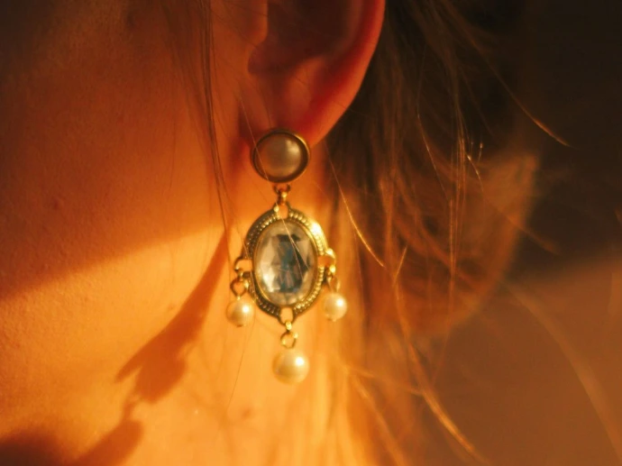 woman wearing silver and gold necklace